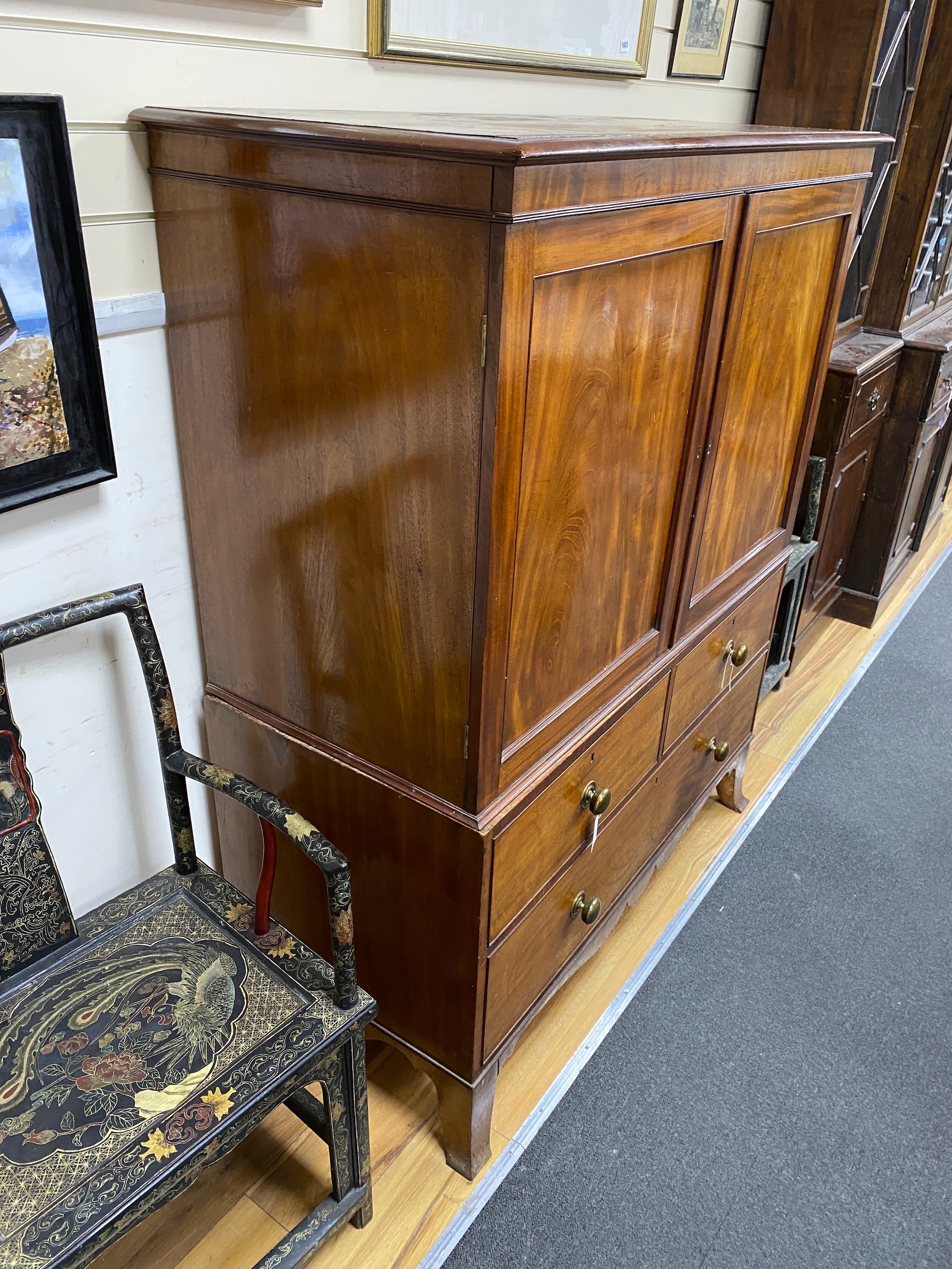 A George III mahogany linen press, now a hanging cupboard, width 124cm depth 57cm height 156cm